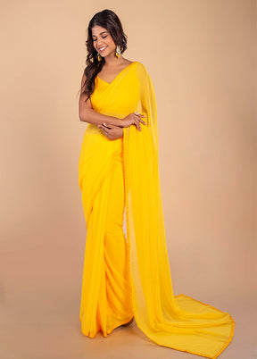 Bright Yellow Georgette Saree by LUKSE