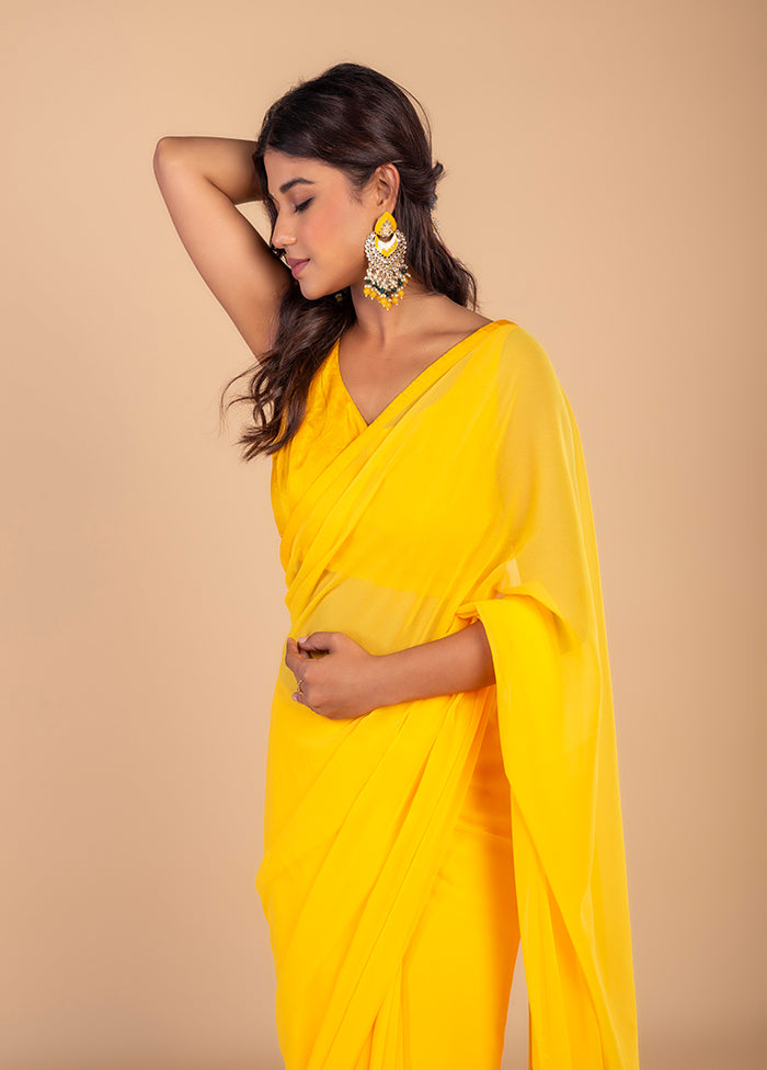 Bright Yellow Georgette Saree by LUKSE