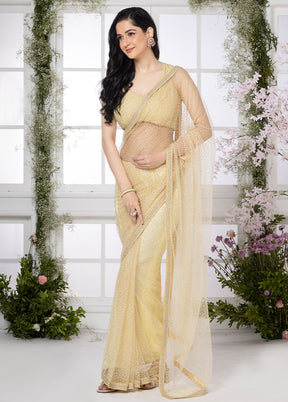 Ivory Golden Whisper Net Saree by LUKSE